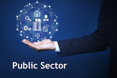 Public Sector concept. Man presenting different virtual icons on blue background, closeup